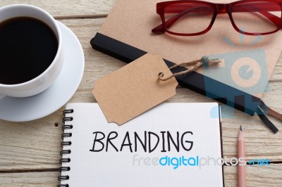 Brand Tag And Notebook With Glasses Stock Photo