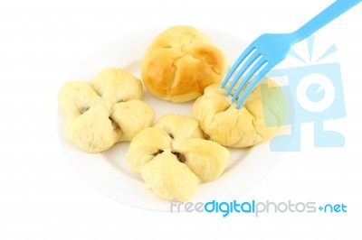 Bread For Breaking Time On Dish And Blue Fork Stock Photo