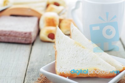 Bread In Plate On Table Stock Photo