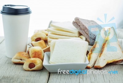 Breads And Coffee Cups On Wooden Stock Photo