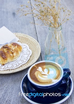 Breakfast Coffee And Almond Croissant Stock Photo