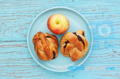 Breakfast With Pastry And Apple Stock Photo