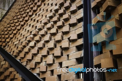 Brick Wall And Black Iron In The Garden Stock Photo