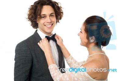 Bride Adjusting Her Man's Bow Tie Stock Photo