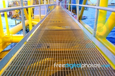 Bridge And Handrail With Grating On Offshore Platform With Light… Stock Photo