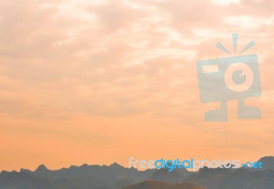 Bright Color Sky Over The Mountain In Evening Time Stock Photo