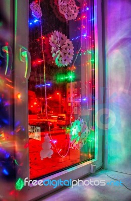 Bright Colored Electric Garland In The Window Stock Photo