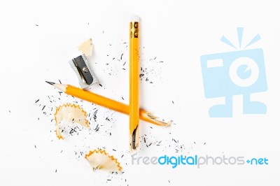 Broken Pencil With Metal Sharpener And Shavings Stock Photo