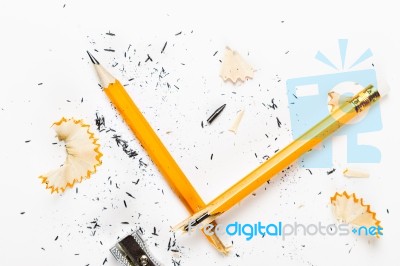 Broken Pencil With Metal Sharpener And Shavings Stock Photo