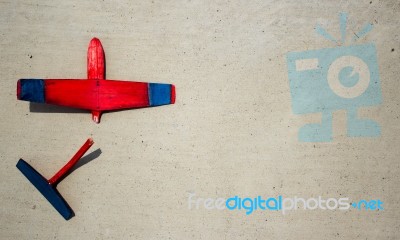 Broken Wodden Glider Lying On Cement Stock Photo