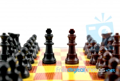 brown and black king on chess board Stock Photo