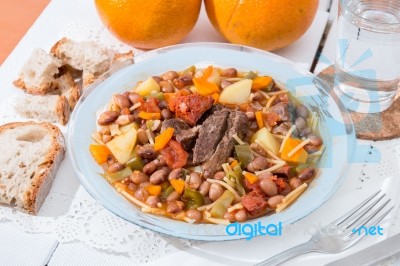 Brown Beans With Meat And Carrot Stock Photo