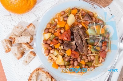 Brown Beans With Meat And Carrot Stock Photo