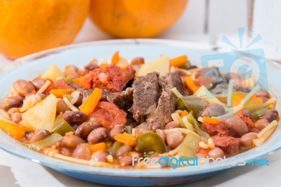 Brown Beans With Meat And Carrot Stock Photo