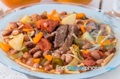 Brown Beans With Meat And Carrot Stock Photo