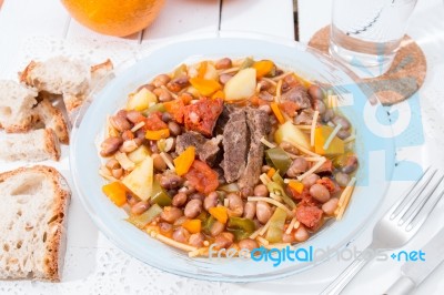 Brown Beans With Meat And Carrot Stock Photo