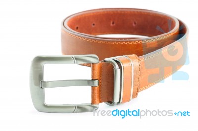 Brown Leather Belt Metal Head On White Floor Stock Photo