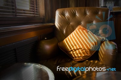 Brown Leather Sofa Chair Nearby Window Stock Photo