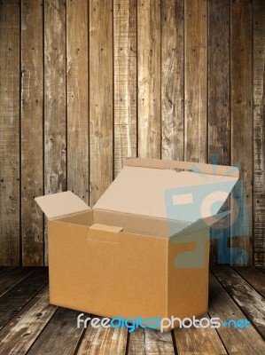 Brown Paper Box On Wood Floor Stock Photo