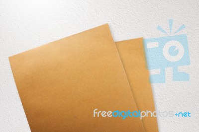 Brown Paper Envelope On Concrete Grunge Background Stock Photo