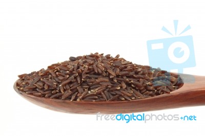 Brown Rice In Ladle Stock Photo