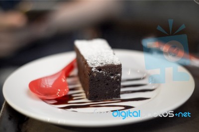 Brownies Topped With Chocolate With Red Spoon On The Dish Stock Photo