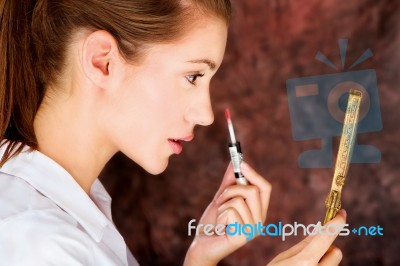 Brunette Applying Lipstick Stock Photo