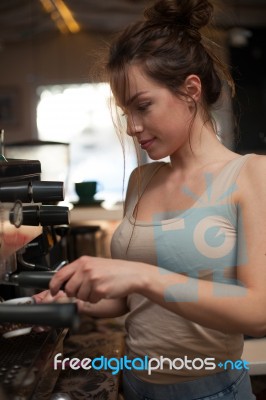 Brunette In Kitchen With Coffee Maker Stock Photo