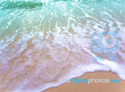 Bubble Of Sea Wave On The Beach Stock Photo