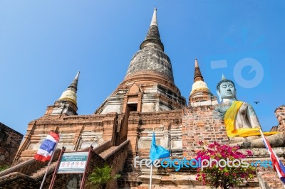 Buddha Statue And Ancient Pagoda Stock Photo