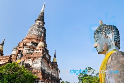 Buddha Statue And Ancient Pagoda Stock Photo