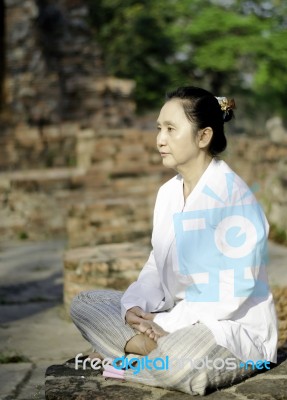 Buddhist Woman Meditating Stock Photo