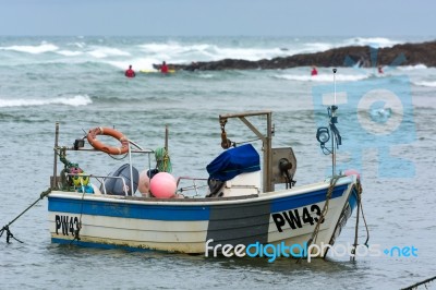 Bude, Cornwall/uk - August 15 : Boat And Surfers At Bude In Corn… Stock Photo