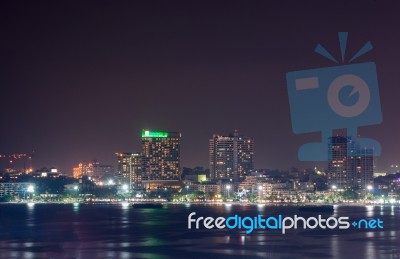 Building Skyline At Night Lights Stock Photo