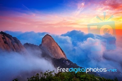 Bukhansan Mountains Is Covered By Morning Fog And Sunrise In Bukhansan National Park, Seoul In South Korea Stock Photo