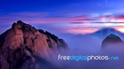 Bukhansan Mountains Is Covered By Morning Fog And Sunrise In Bukhansan National Park, Seoul In South Korea Stock Photo