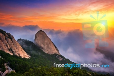 Bukhansan Mountains Is Covered By Morning Fog And Sunrise In Bukhansan National Park, Seoul In South Korea Stock Photo