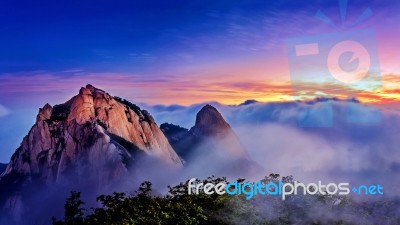 Bukhansan Mountains Is Covered By Morning Fog And Sunrise In Bukhansan National Park, Seoul In South Korea Stock Photo