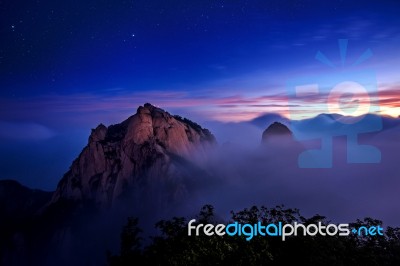 Bukhansan Mountains Is Covered By Morning Fog And Sunrise In Bukhansan National Park, Seoul In South Korea Stock Photo