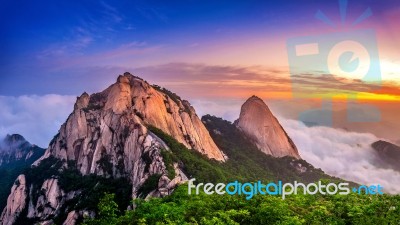 Bukhansan Mountains Is Covered By Morning Fog And Sunrise In Bukhansan National Park, Seoul In South Korea Stock Photo