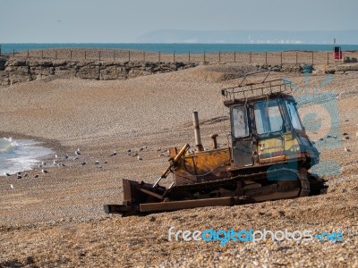 Bulldozer On Hastings Beach Stock Photo