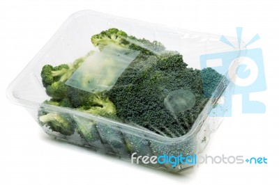 Bunch Of Broccoli Vegetables Wrapped In Plastic Stock Photo