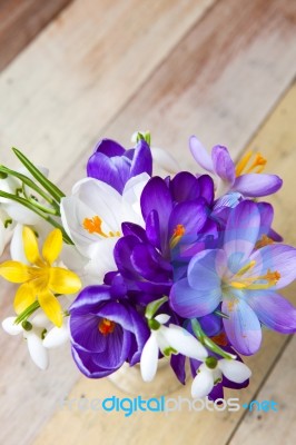 Bunch Of Spring Flowers. Crocus And Snowdrops On The Wooden Back… Stock Photo