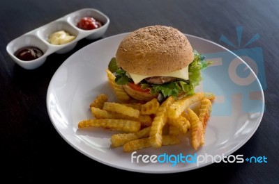 Burger And Fries With Ketchup Stock Photo