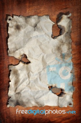 Burned Paper With Wooden Board Stock Photo