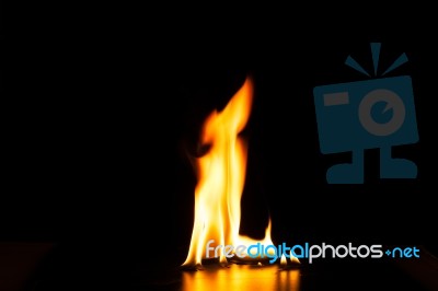 Burning Fire Flame On Black Background Stock Photo