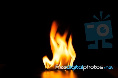 Burning Fire Flame On Black Background Stock Photo