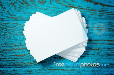 Business Card On Blue Wood Background Stock Photo