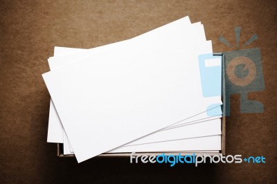 Business Cards On Dark Brown Cardboard Stock Photo