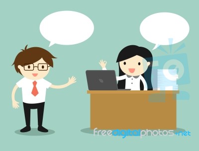 Business Concept, Business Woman Working On Her Desk While Talking With Businessman Stock Image